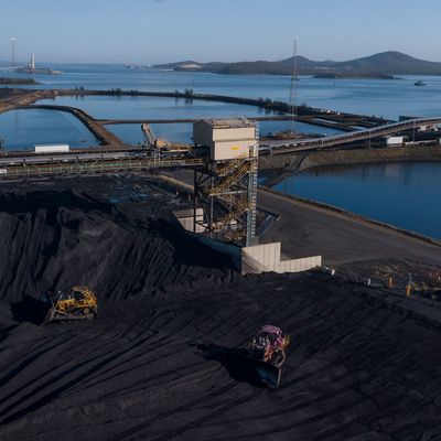 Coal stockpile and conveyor at a loading port
